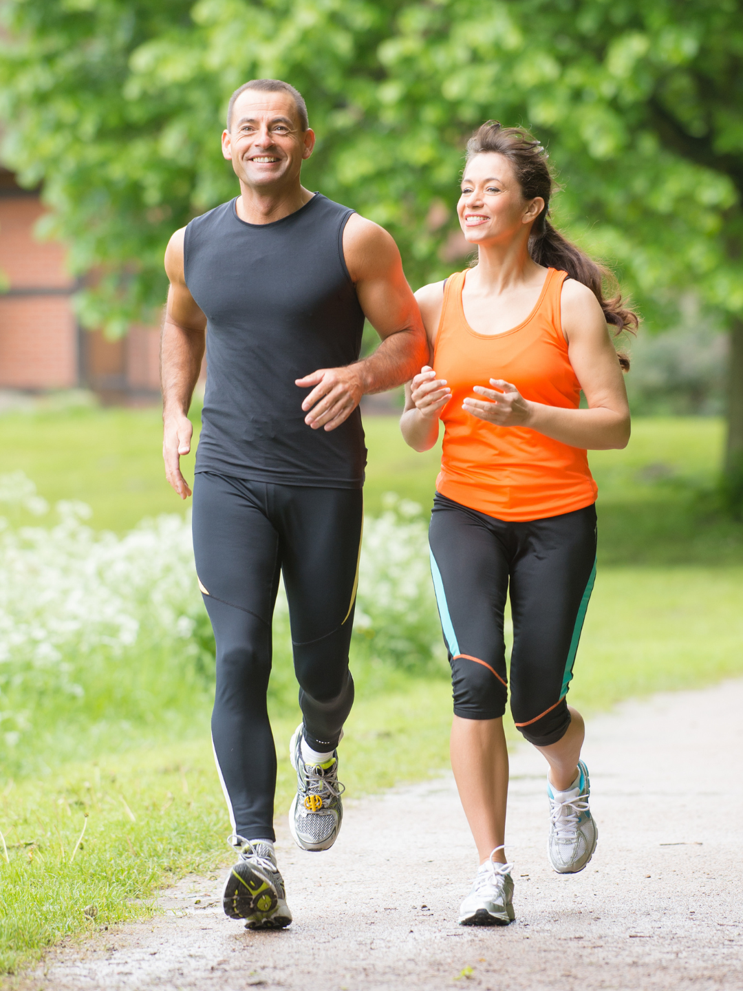 Active midlife couple running together